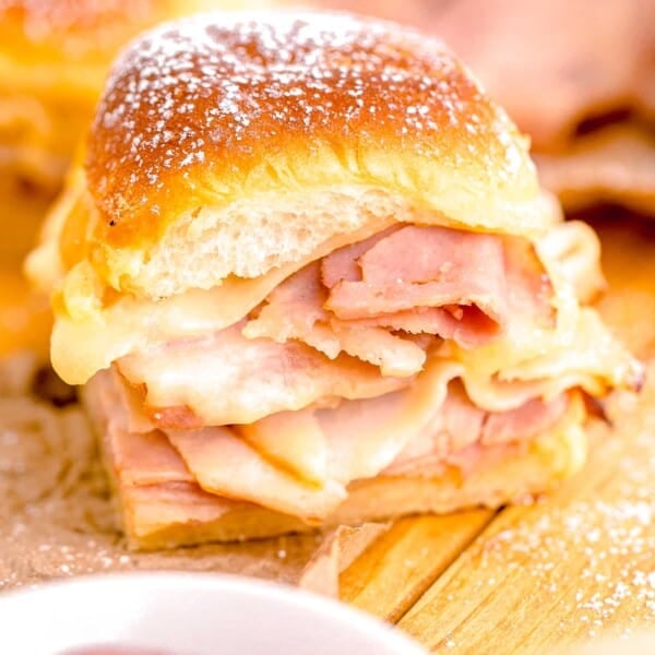 a monte cristo slider is presented on a wooden surface