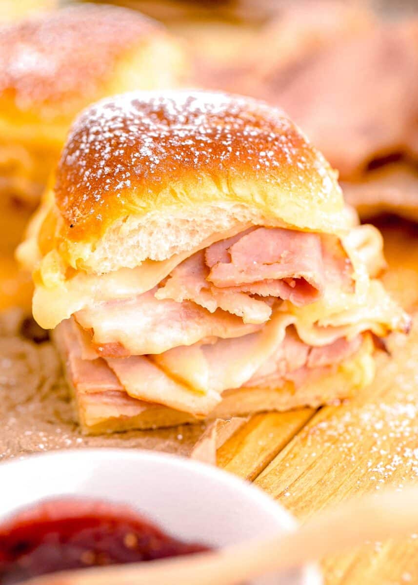 a monte cristo slider is presented on a wooden surface