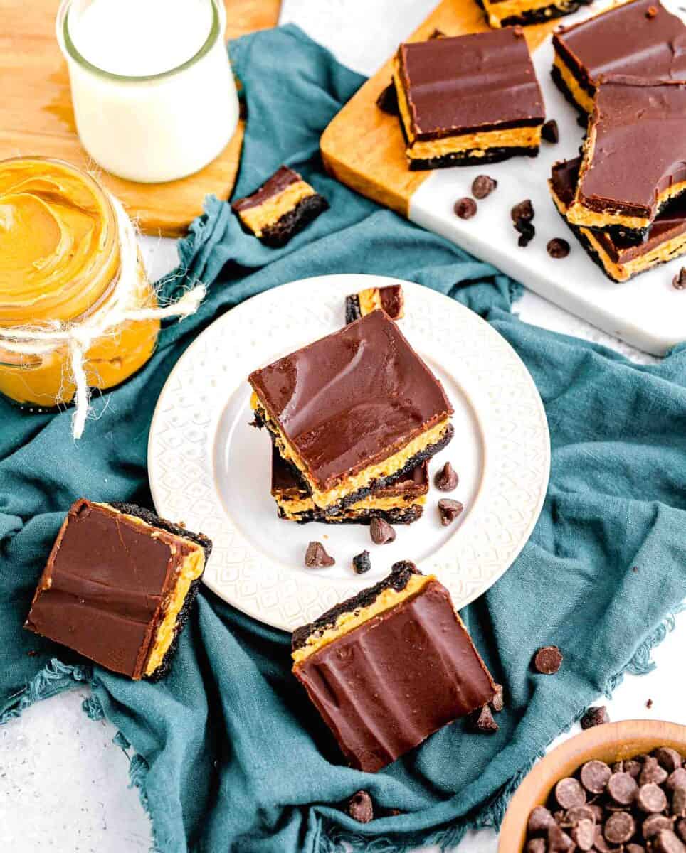 several buckeye brownies are scattered around a white plate