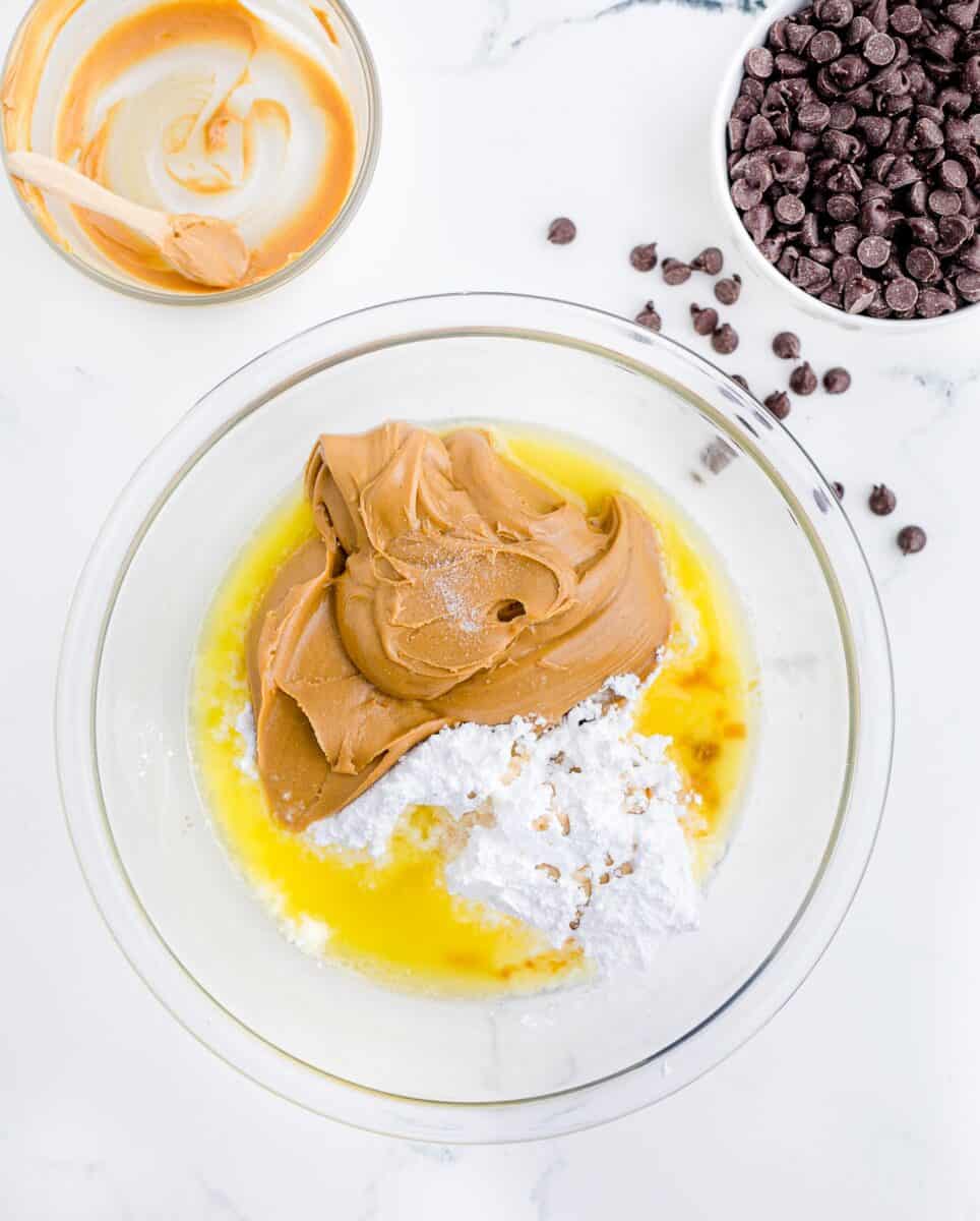 butter, powdered sugar and peanut butter are presented in a glass bowl