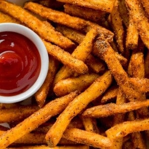 crispy, perfectly fried cajun fries and ketchup