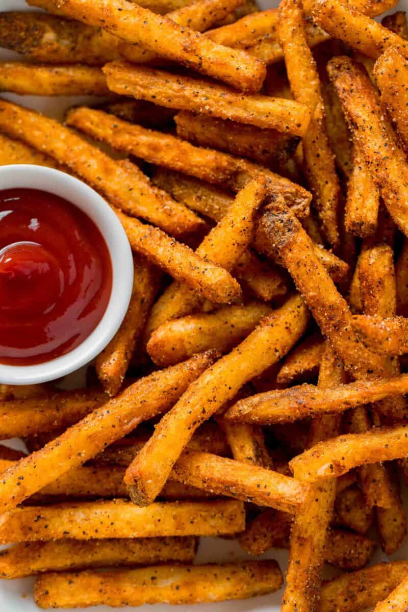 crispy, perfectly fried cajun fries and ketchup