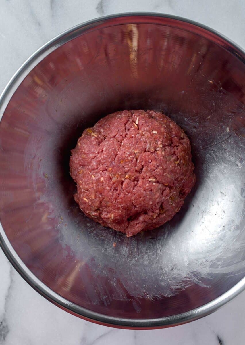 beef mixture mixed up in a metal bowl