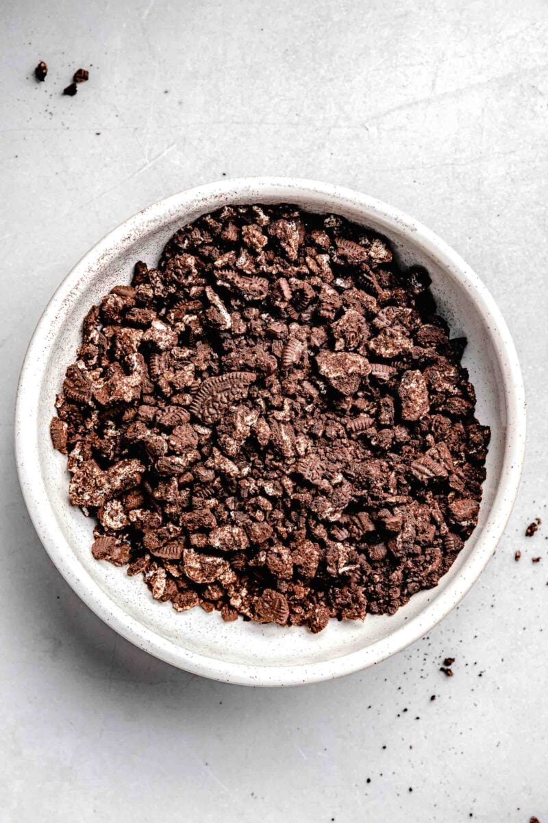 crushed up oreo cookies in a white bowl