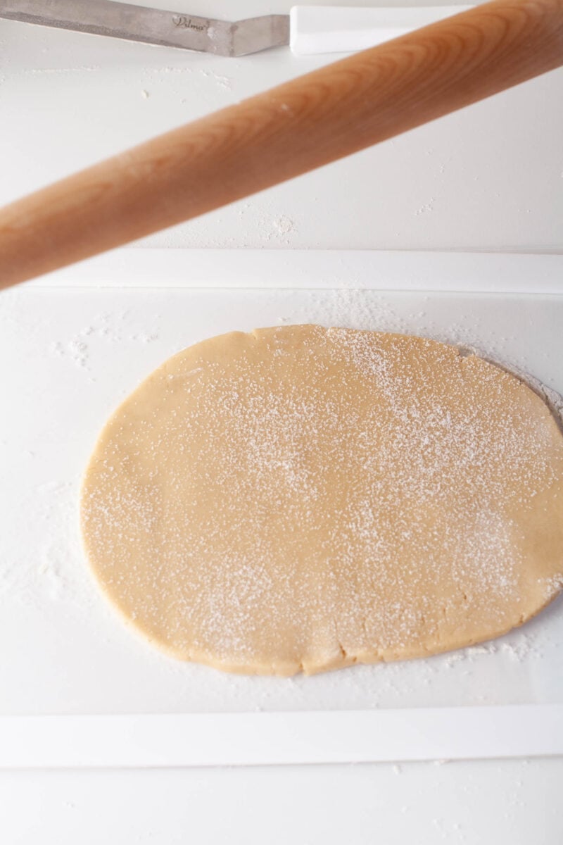 cookie dough has been rolled out on a white surface