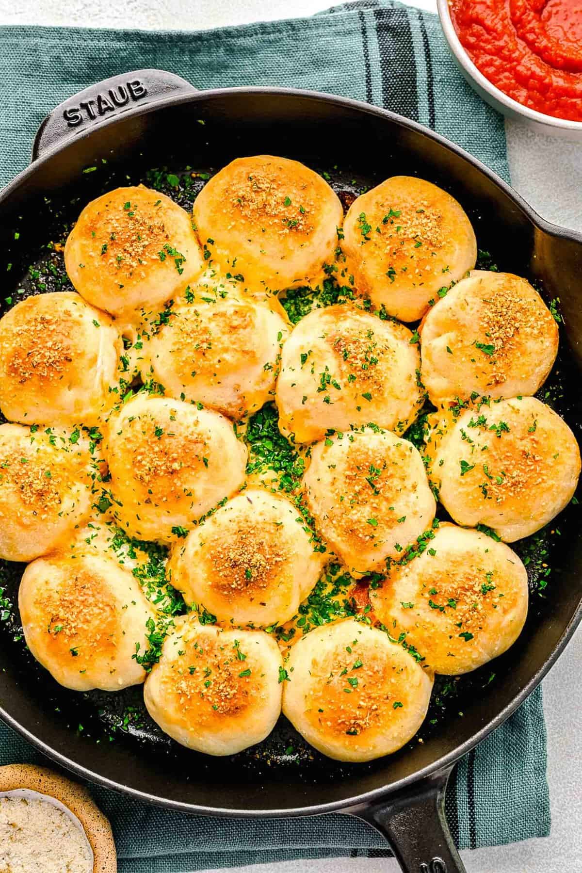 Overhead of pizza bites in a skillet.