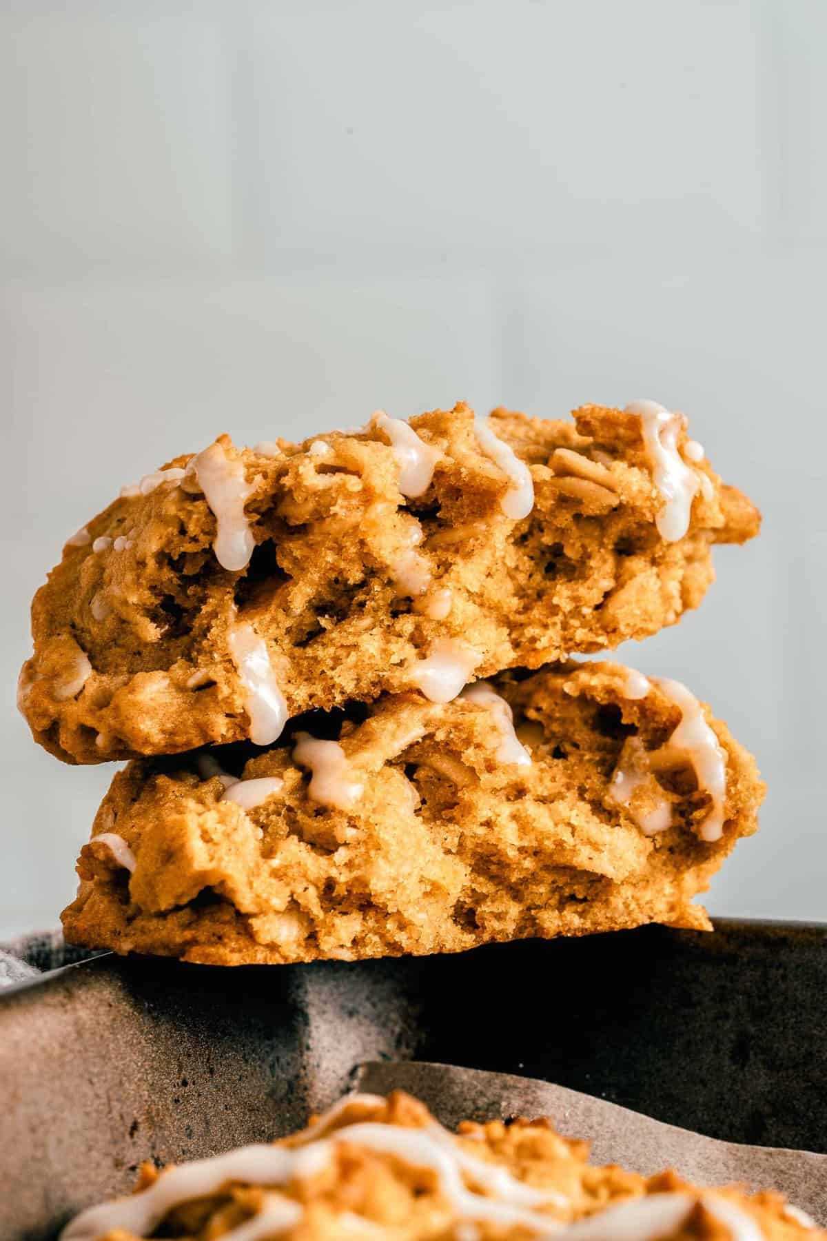 Two pumpkin oatmeal cookies stacked on top of each other.