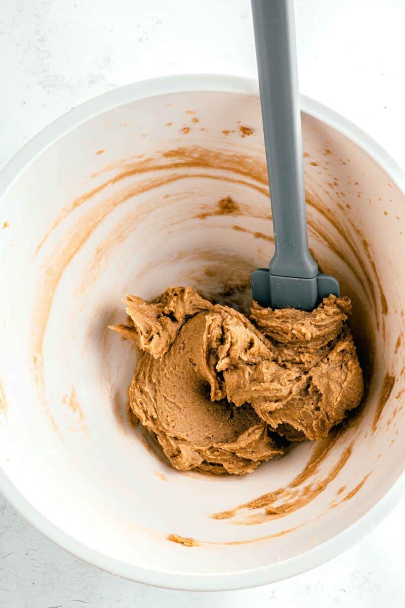 cookie dough has been mixed together in a white bowl