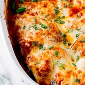 cheese is melted across the top of baked rollatini