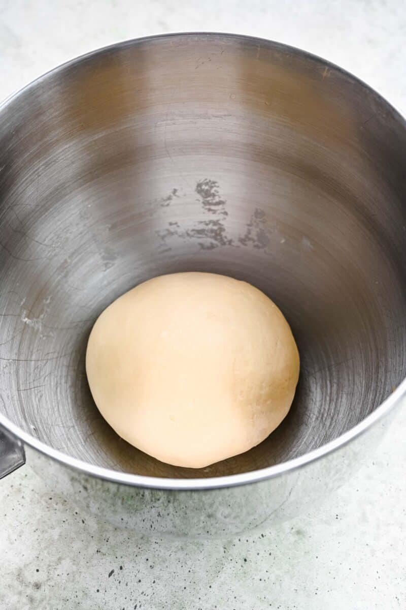round dough ball in a metal stand mixer bowl