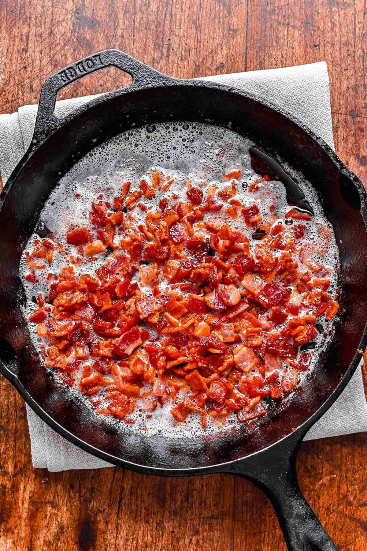 Cooking bacon in a skillet.