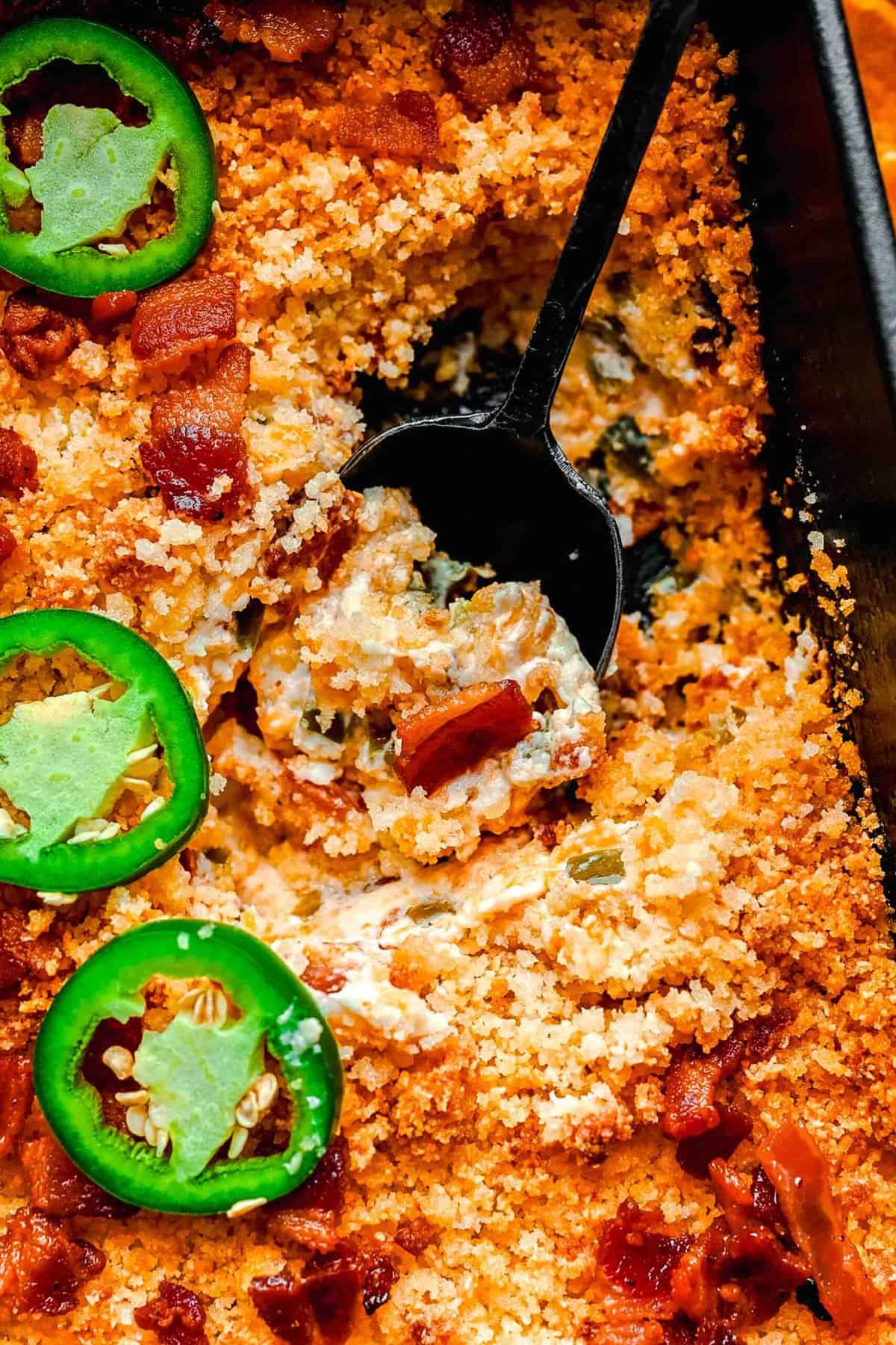 Taking a scoop out of jalapeno popper dip.