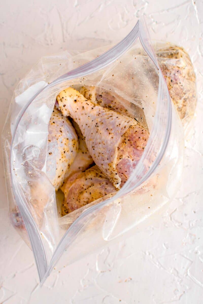 lemon pepper drumsticks in a plastic bag