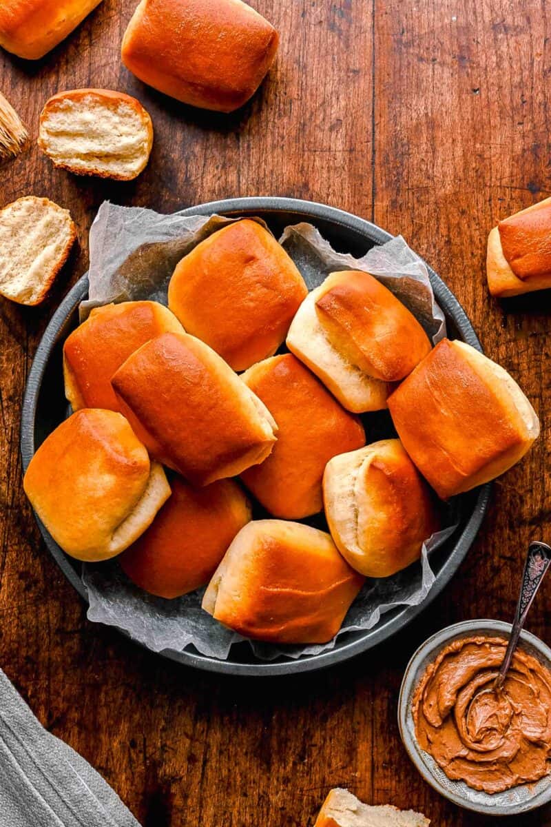 a batch of texas roadhouse rolls are placed in a basket