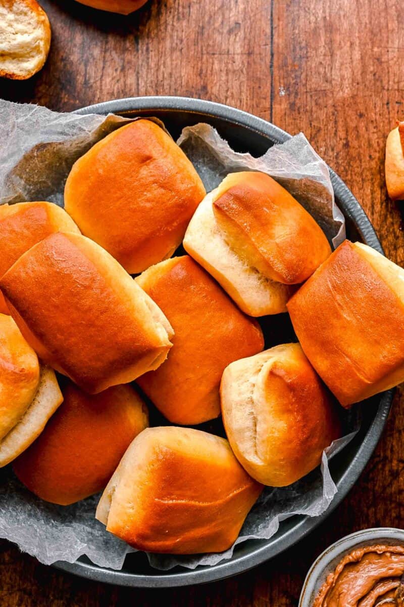 baked rolls are placed in a parchment paper lined basket