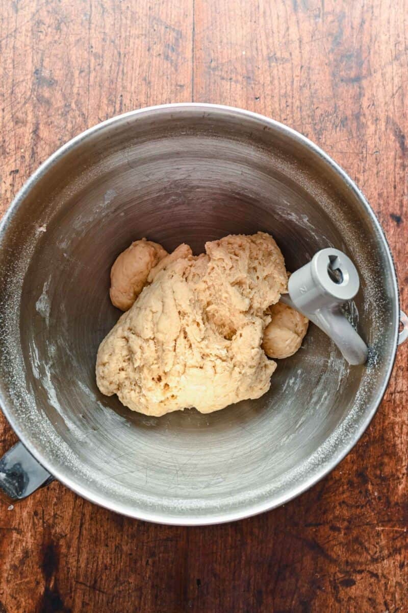 ingredients are being mixed to create dough