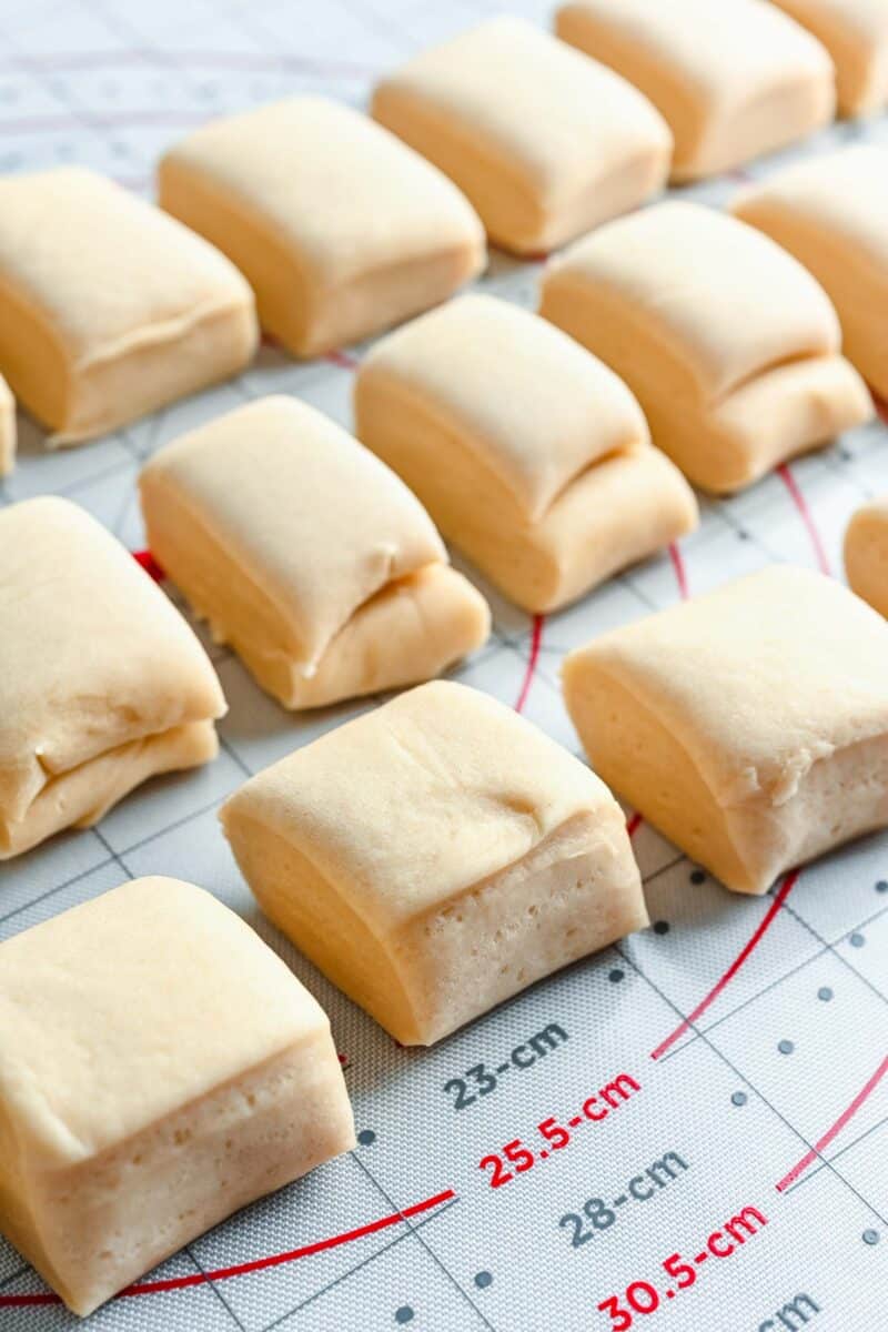 unbaked rolls are placed next to one another
