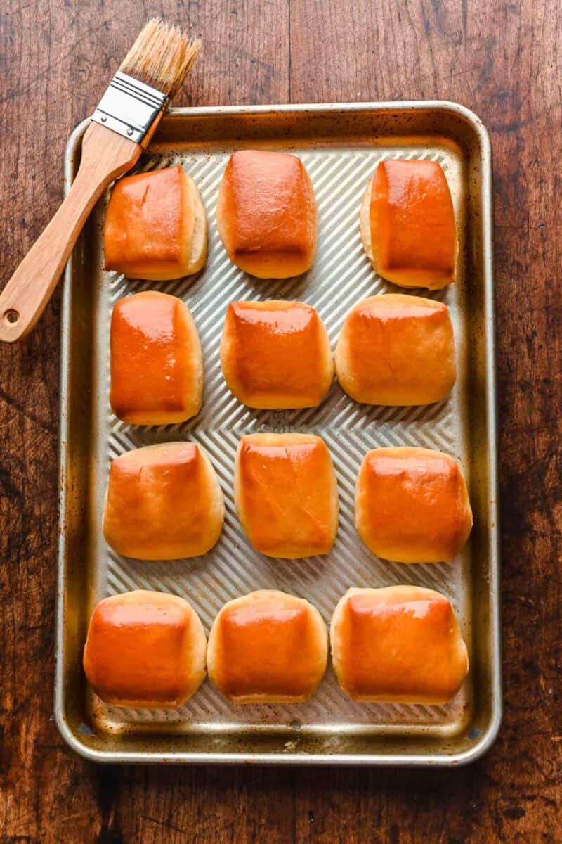 freshly baked rolls are spread out on a baking sheet