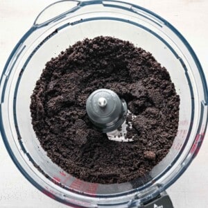 crushed oreos in a bowl of a food processor