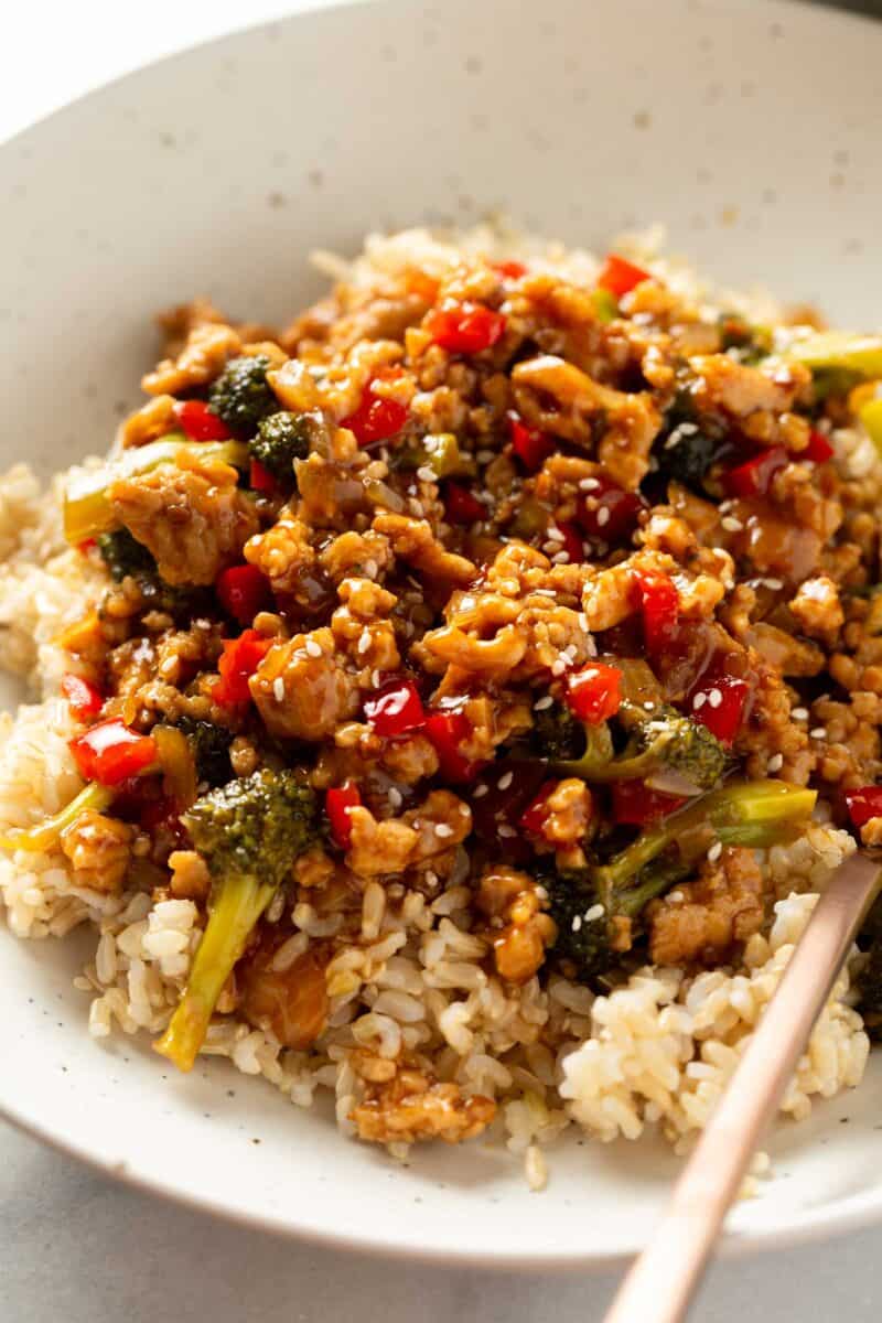 ground turkey teriyaki on top of brown rice in a bowl