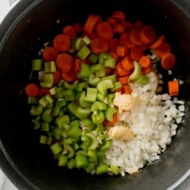 carrots, celery, onion, and garlic added to a large dutch oven