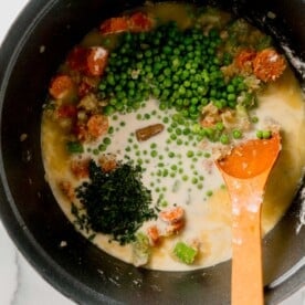 peas, fresh parsley, and chicken bouillon cube added to the liquid mixture