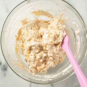biscuit mixture mixed together with a spatula in a glass bowl