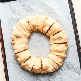 crescent dough triangles tucked and sealed around the seasoned ground beef