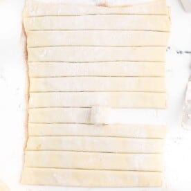 puff pastry sheets sliced lengthwise with one being rolled