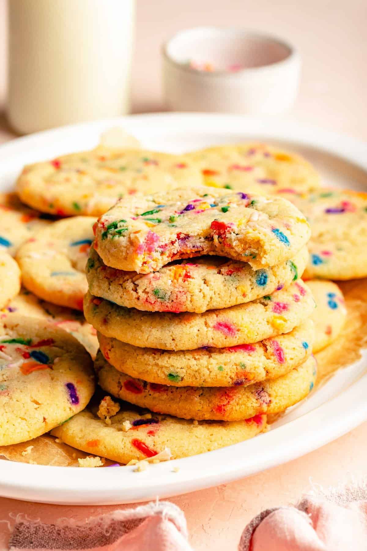 Funfetti cookies stacked on a platter.