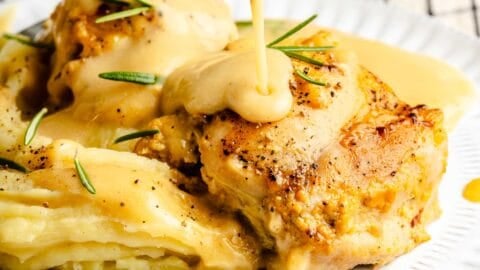 Pouring sauce over yum yum chicken.