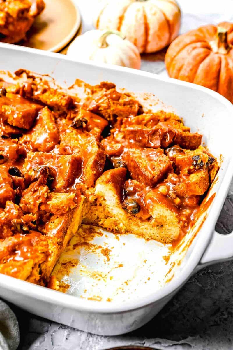 interior of baked pumpkin bread pudding in a white casserole dish