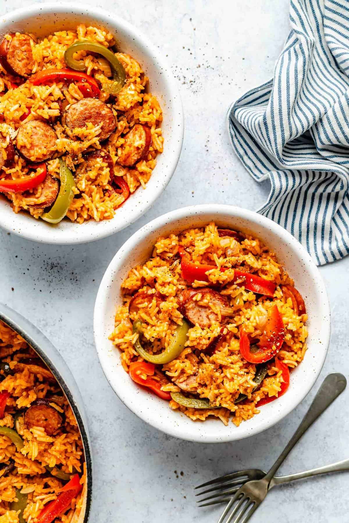 Sausage and rice served in bowls.