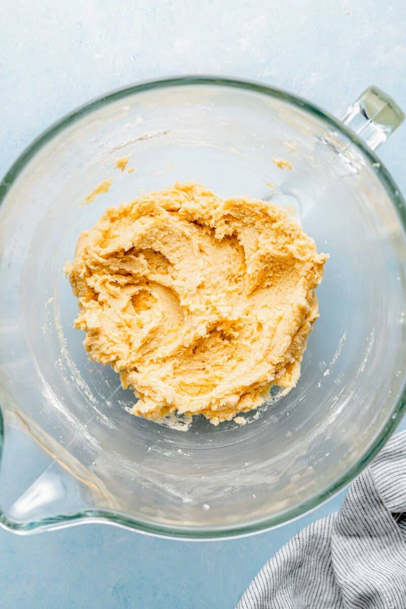 Mixing together wet and dry ingredients for lemon cookie dough.