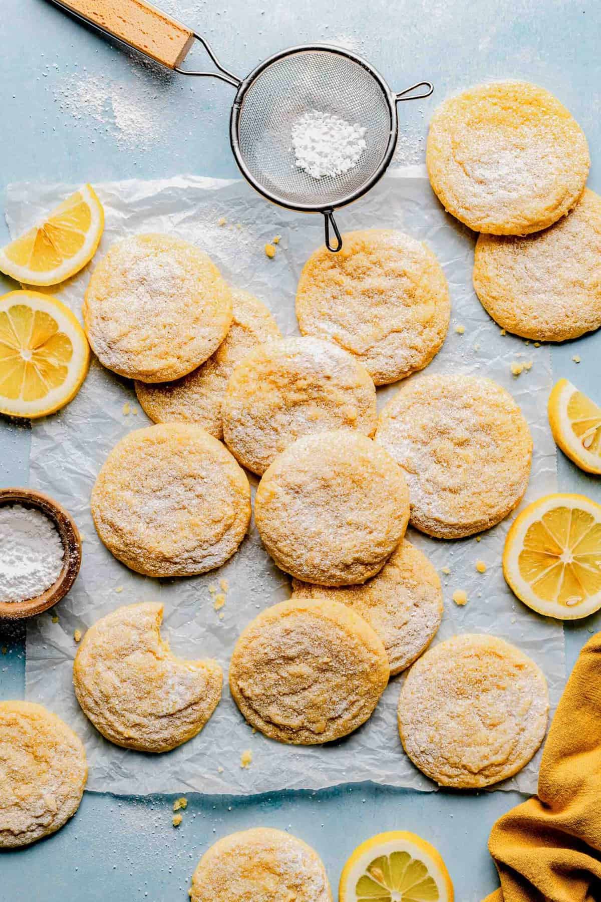 Dusting lemon cookies with powdered sugar.