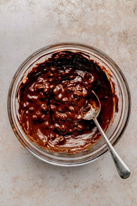 Melting chocolate chips and coconut oil together.