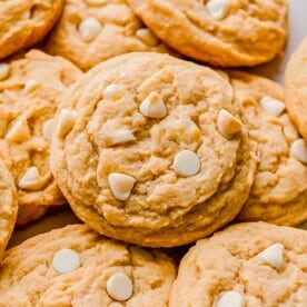 white chocolate chip cookie with white chocolate chips dotted on top of the cookie