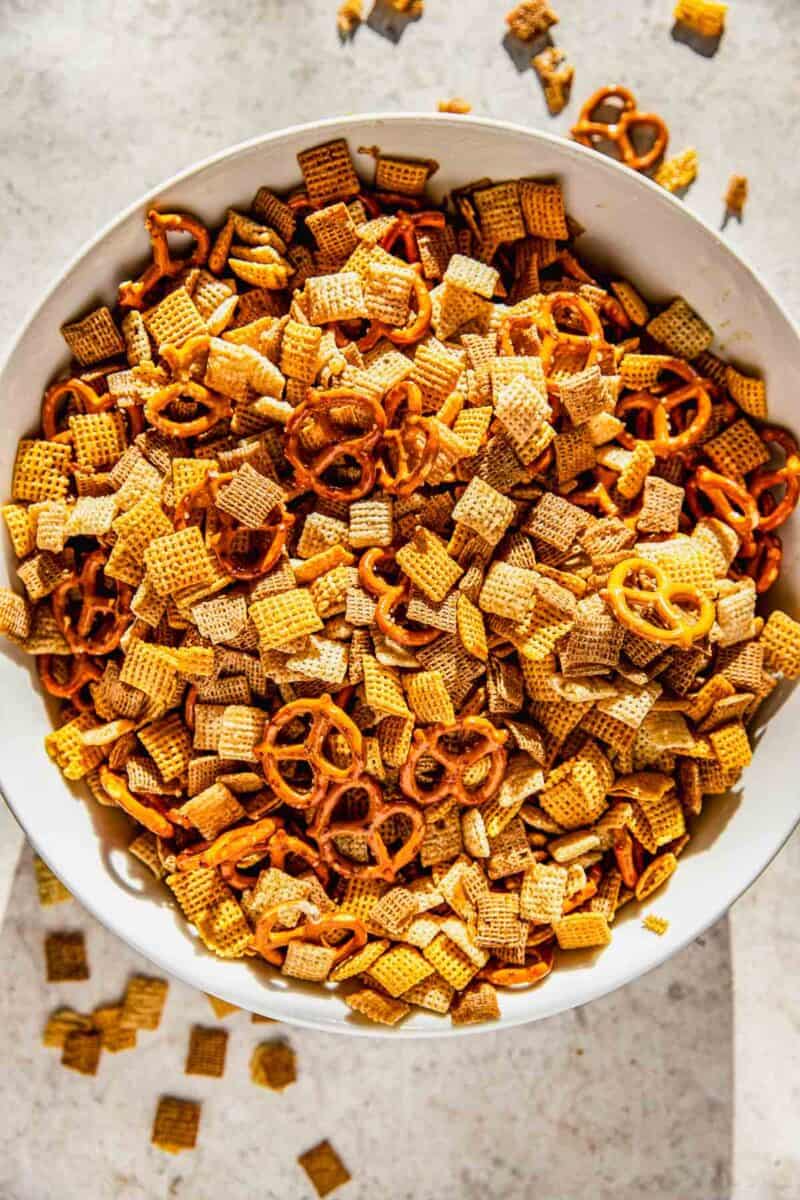 chex cereal and pretzels mixed together in a large bowl