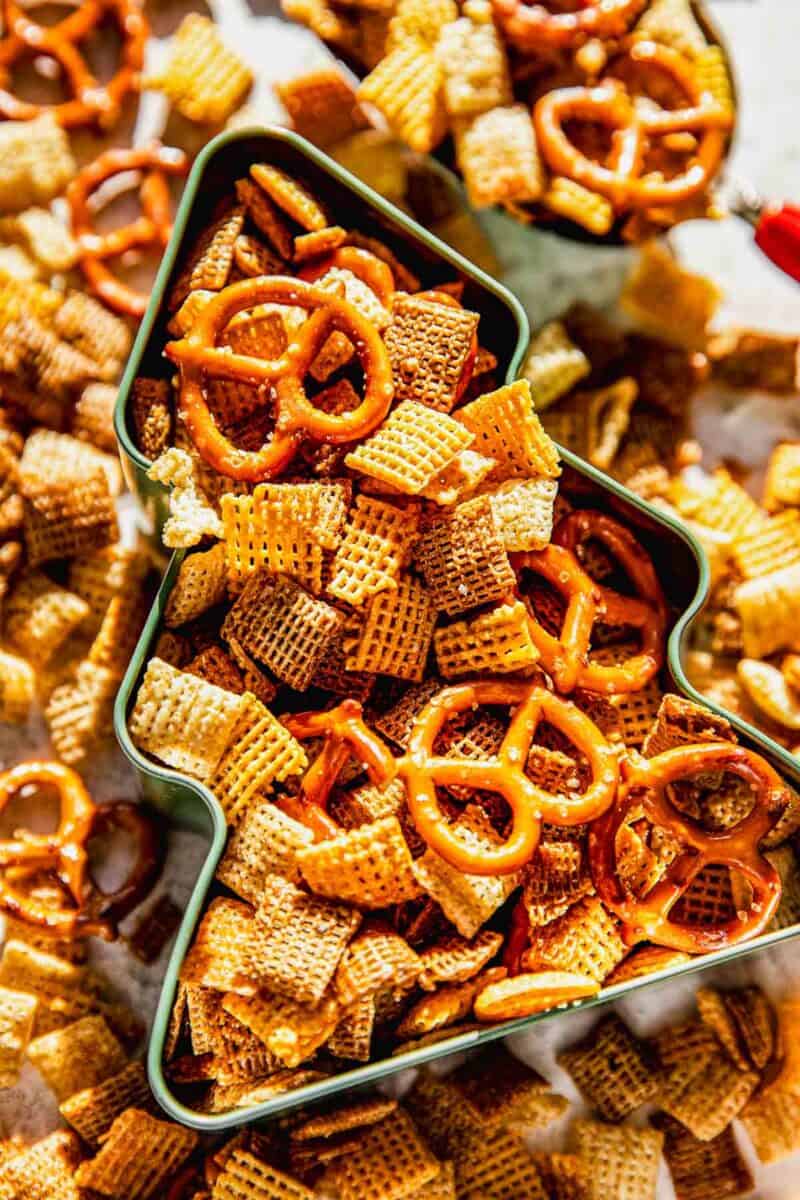 homemade chex mix in a metal christmas tree tin