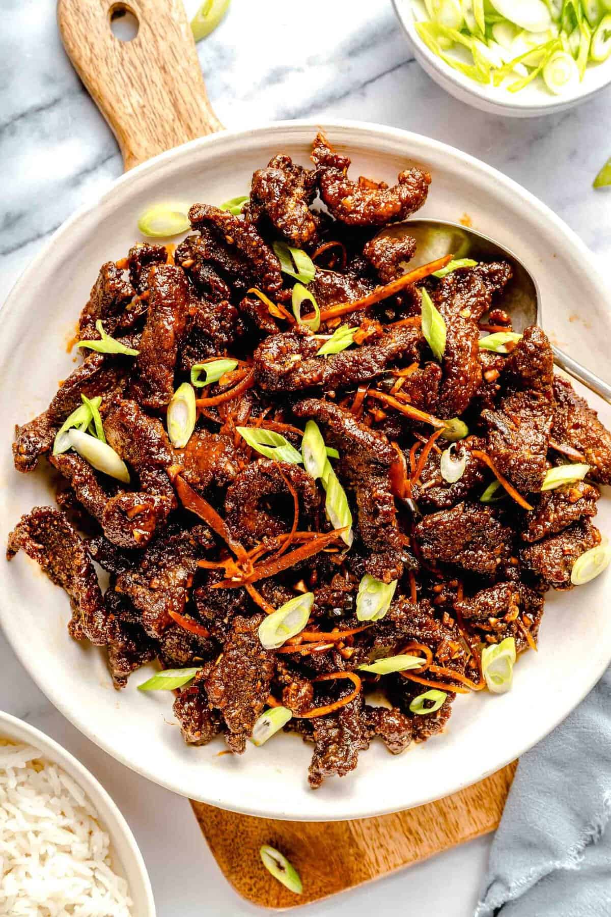 Overhead image of crispy beef on a serving platter.