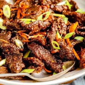 A serving platter full of crispy beef.