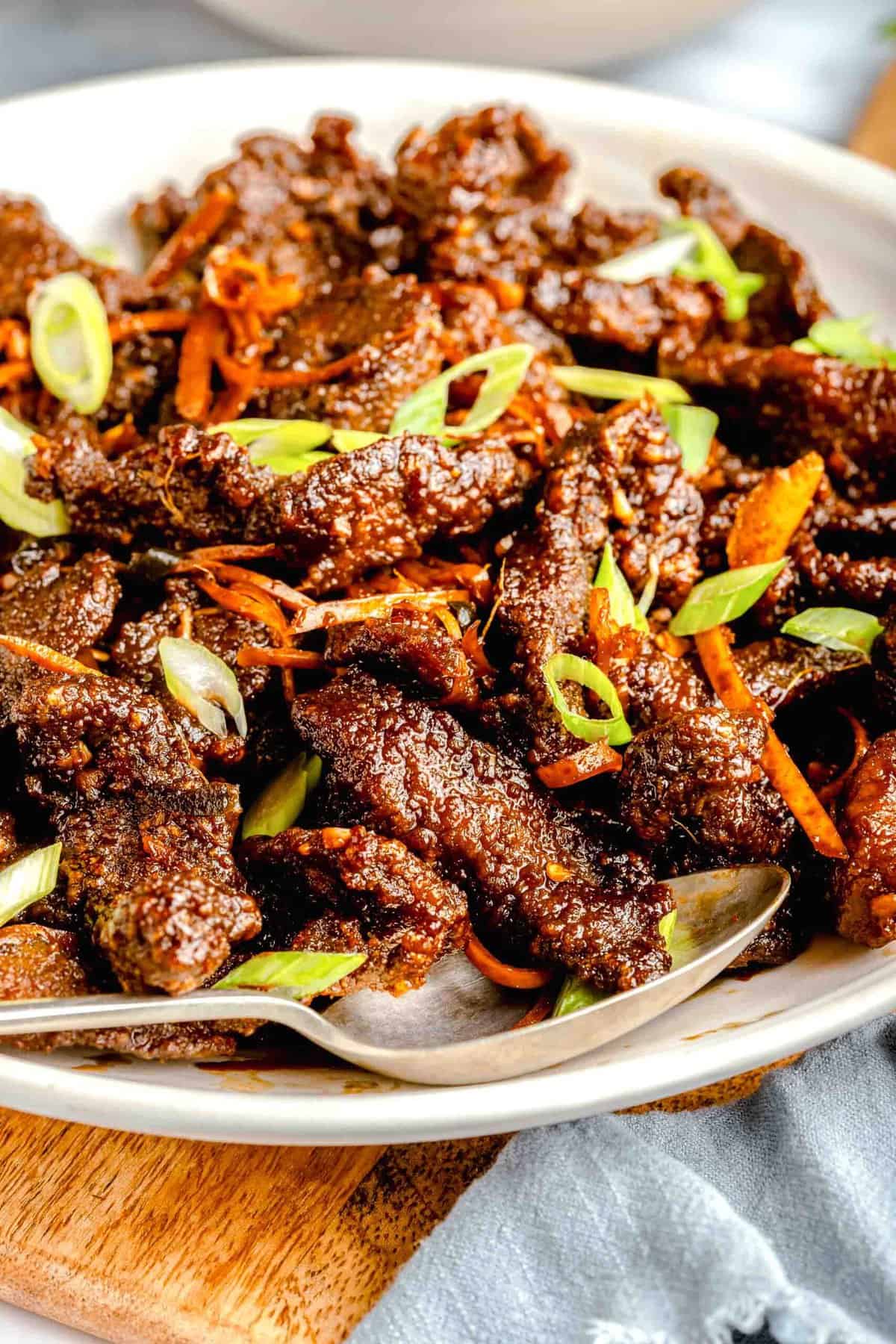 A serving platter full of crispy beef.