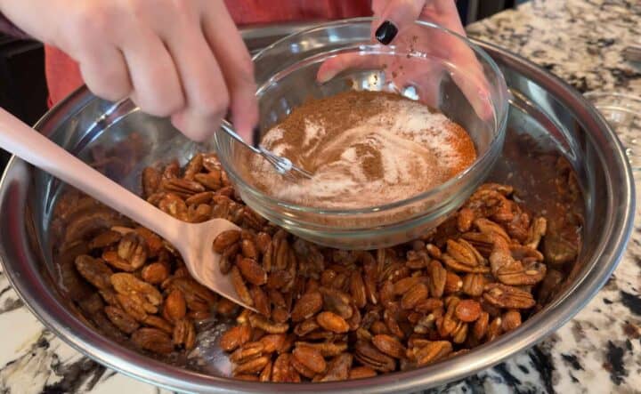 whisking together cinnamon sugar spice mixture in a clear bowl