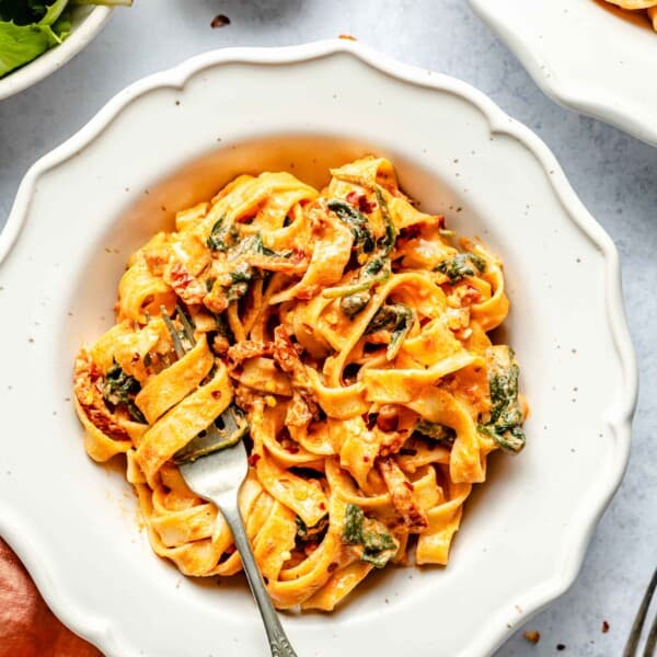 sun-dried tomato pasta twirled around a metal fork