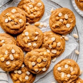 white chocolate macadamia nut cookies on a wire circular rack