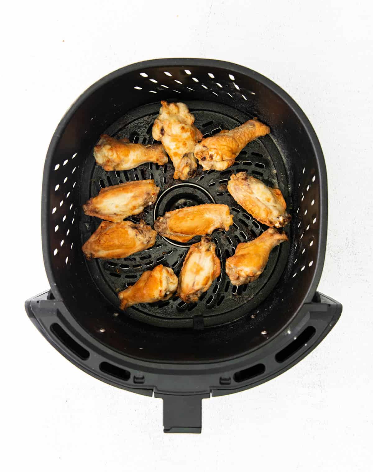 air fried chicken wings in an air fryer basket