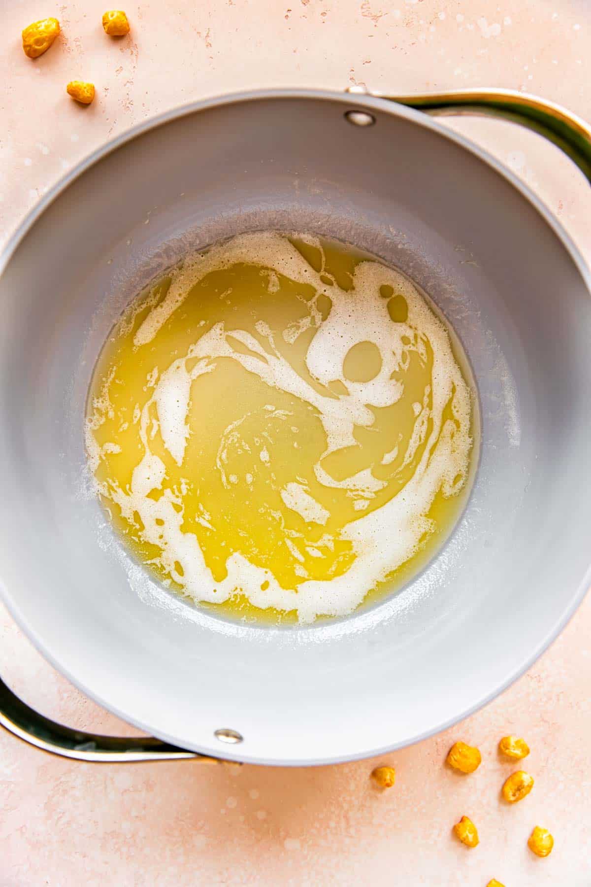Butter is melting in a pan. 