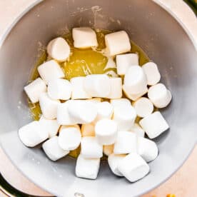 Marshmallows have been added to a skillet with melted butter.