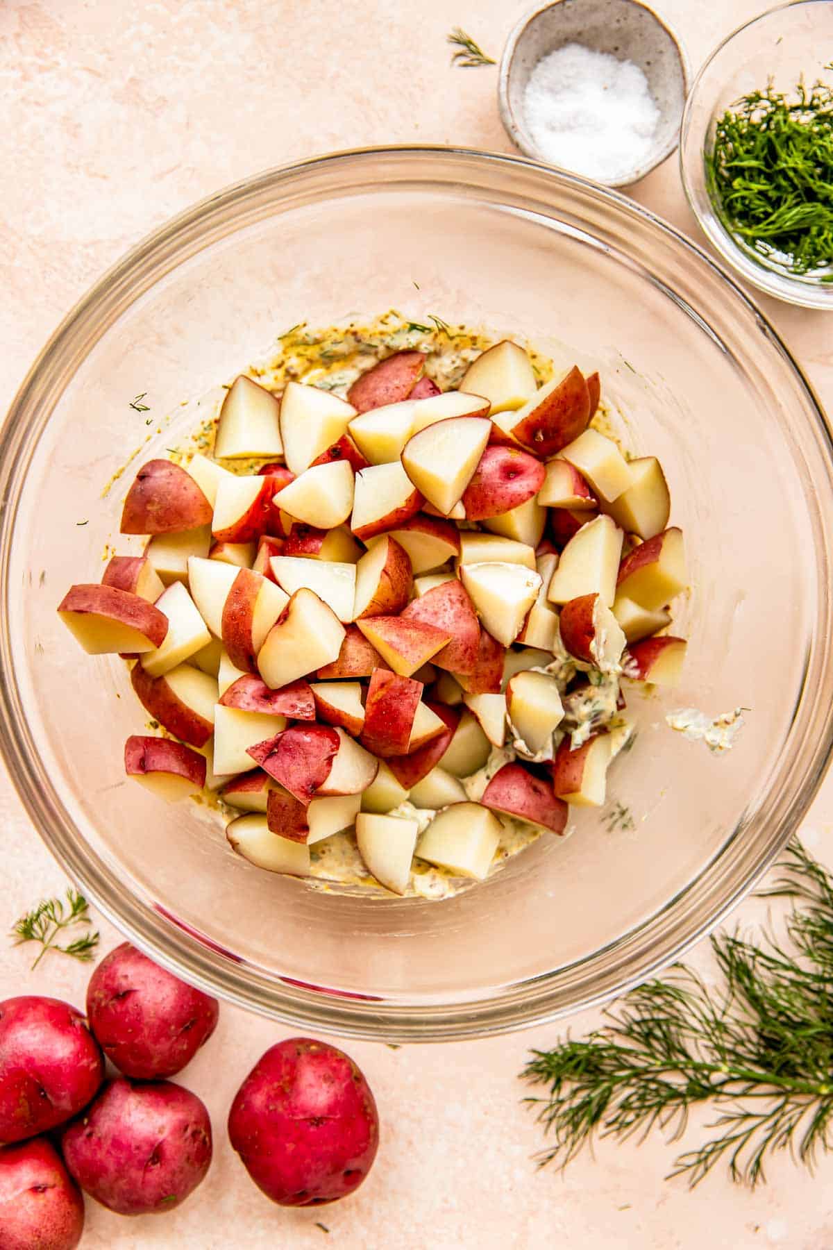 Chopped red potatoes have been added to a mixing bowl. 