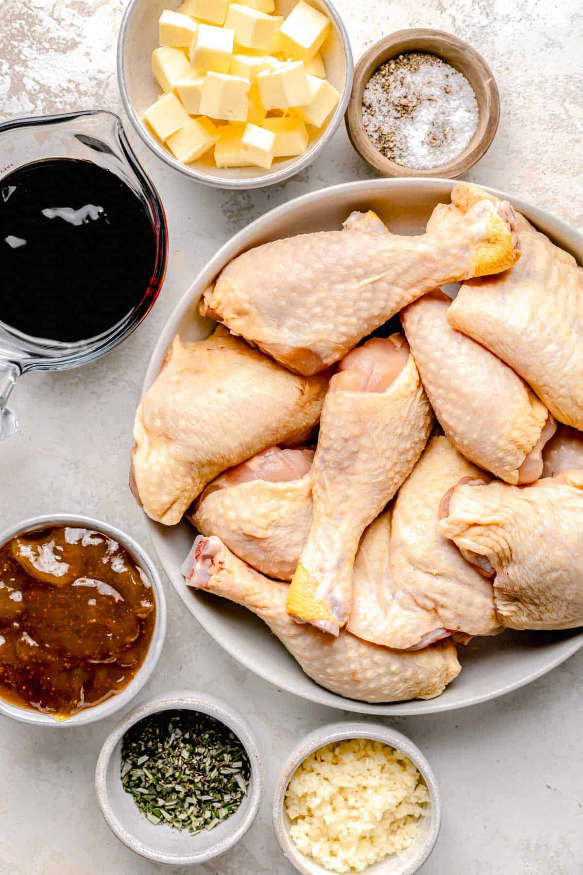 the ingredients for fig and rosemary chicken are on a white surface